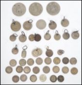 A good collection of silver coins dating from the 19th century, most coins have been mounted at some