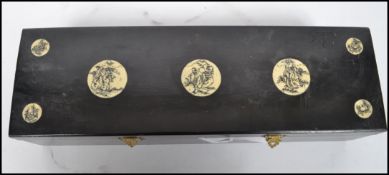 A vintage 20th century Oriental Chinese Mahjong set, the pieces of bone and ebony construction