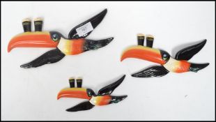 A set of three vintage 20th century Carlton Ware ceramic Guinness advertising graduating toucan wall