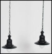 A pair of retro / vintage industrial style factory pendant of enamel metal in the UFO style. both in