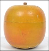 A 19th century turned / treen fruit wood tea caddy in the form of an apple. Measures 10 cm high.