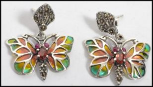 A good pair of silver and plique a jour  butterfly earrings of drop form complete in the