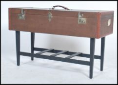 A vintage retro 20th century up-cycled coffee table constructed from a leather suitcase with locks