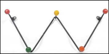 A vintage retro 20th century  sputnik atomic set of coat hooks in a painted black finish with