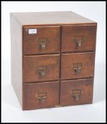 A vintage 20th century 1930s bank of six industrial oak filling cabinet. Each drawer fitted with