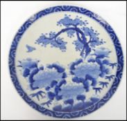 A 20th century large blue and white Chinese charger having geometric patterns being stamped to the