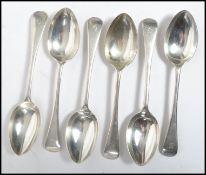A set of 6 solid silver hallmarked dinner spoons having monograms to the handles bearing hallmarks
