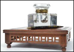 A stunning Victorian 19th century desk top mahogany aesthetic movement oversized ink well, the