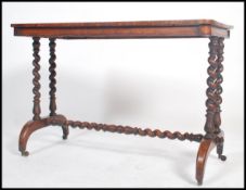 A 19th century Regency tiger oak writing table - library table desk being raised on arched feet