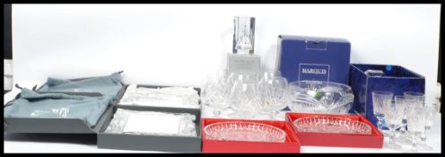 A collection of boxed Waterford crystal items to include two unused Year 200 portrait wedding frames