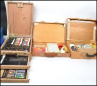 A good collection of artists paint boxes to include oil paints, palette, pastels, paper,  brushes