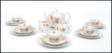 A vintage 20th century Bavarian tea service to include cups, saucers, tea pot, sugar bowl, creamer