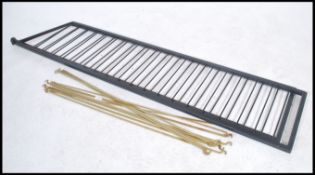 A pair of vintage Ladderax ebonised metal upright frames together with five pairs of ladderax