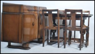 A 1940's post war Art Deco dining room suite comprising an oak draw leaf refectory dining table
