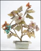 An Oriental Chinese model of a bonsai plant constructed from semi precious stones to include jade,