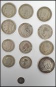 A collection of pre decimal silver coins to include a 1893 Victorian crown, six half crowns, four