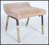 A vintage mid century Ernest Gomme ( G-Plan ) stool being raised on metal bronzed legs and stamped