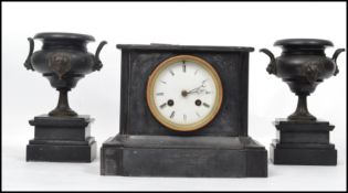 A 19th century Marti French black marble slate mantle clock and garniture set having a white