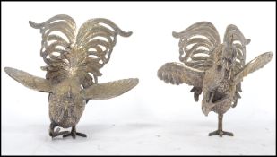 A 20th century pair of good silver plate fighting cocks - cockerel, both in differing aggressive