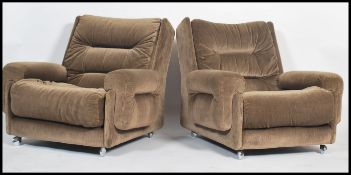 A pair of vintage retro G-Plan 'saddle ' style armchairs in the manner of Kofod Larsen. Each