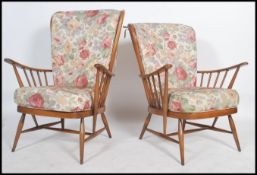 A good pair of 20th century retro Ercol Windsor armchairs. The turned legs united by stretchers