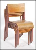 A set of four vintage green painted tubular steel framed child's school stacking chairs with moulded