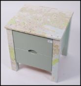 A 20th century up - cycled straight chest of drawers having two drawers raised on straight legs