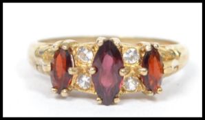 A vintage 20th century silver gilt three stone gar