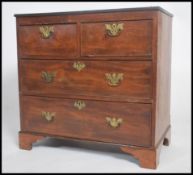 A 19th century mahogany batchelors chest of drawers, two over two cockbeaded drawers with swag brass
