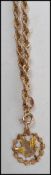 A hallmarked 9ct gold rope twist link necklace chain having a bolt ring clasp with a 10k gold