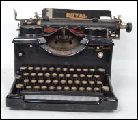 A vintage early  20th century typewriter by Royal with glass panels to side, logo for Royal to