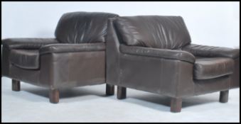 A pair of vintage 20th century original Tetrad retro leather brown armchairs raised on squared