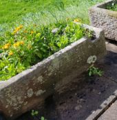An  antique 19th century natural stone trough  of rectangular shaped form being hewn hand carved