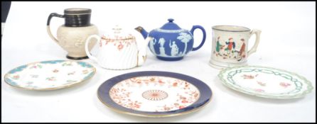 A group of 19th century ceramics to include a Staffordshire tankard depicting a tavern scene with