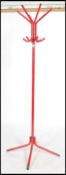 A retro 20th century sputnik atomic coat / hat stand of tubular construction in a red finish.