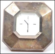 A 20th century silver hallmarked clock of octagonal form in the art deco style by RJC being