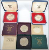 A pair of Royal Mint 1977 silver proof crown coins complete in original boxes along with two 1951