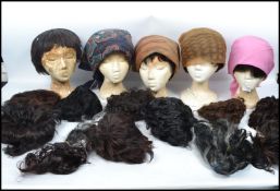 A good collection of mannequin busts together with a large collection of ladies wigs / hair pieces