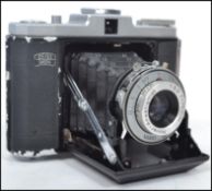 A vintage mid  20th century German Zeiss Ikon Novar Anastigmat Nettar folding bellows 35mm camera.