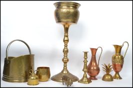 A collection of vintage 20th century brass and copper wares to include a large jardiniere planter on