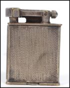A vintage 20th century Parker The Beacon Roller lighter having an engine turned design. Measures 5