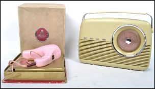 A vintage mid 20th century Bush Type TR82B portable radio together with a boxed Pifco hairdryer in