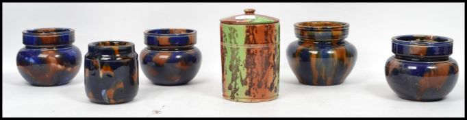 A good group of 19th century Victorian splat ware ceramic tobacco jars with lids having a tortoise