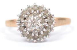 A hallmarked 9ct gold diamond cluster ring having