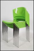 A set of six stackable Galvano Tecnica ' Brilla ' dining chars in lime green having a plastic shaped