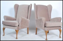 A good pair of newly upholstered believed Parker Knoll armchairs raised on mahogany cabriole legs