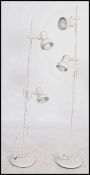 A pair of retro 20th century matching floor standing adjustable multi light spot lamps raised on