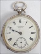 A silver hallmarked late Victorian pocket watch by Fattorini, Skipton having inset Waltham movement.