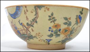 A 19th century Oriental Chinese ceramic bowl the famille jaune ground decorated with domestic scenes
