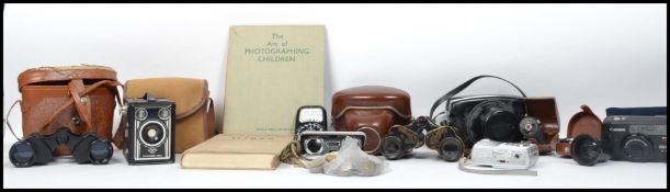 A collection of vintage cameras and accessories to include Yashica Minister D, Agfa Super Silette